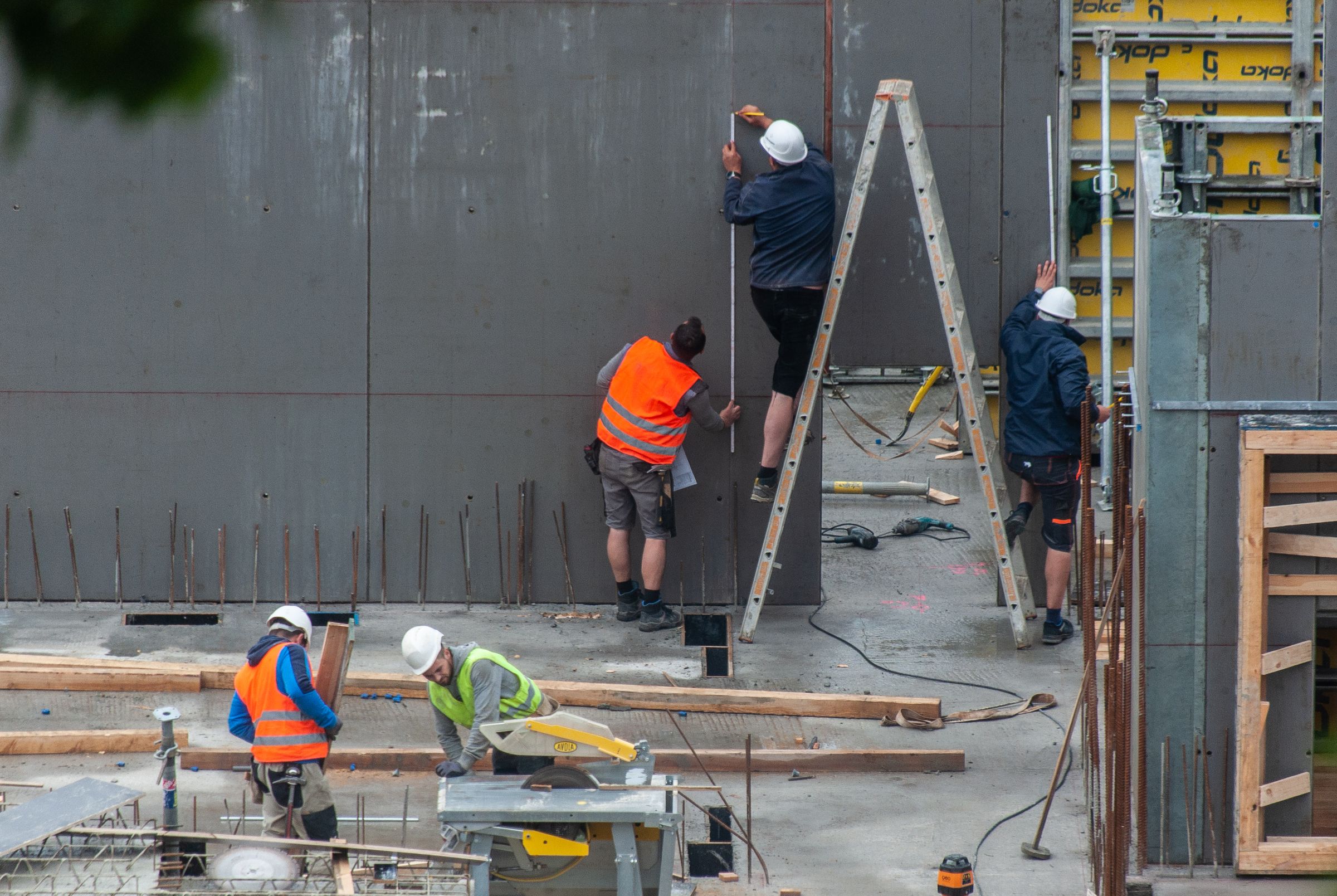Site labourers working together during concrete construction